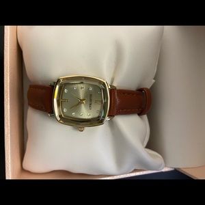 Ellen Tracy gold tone watch.